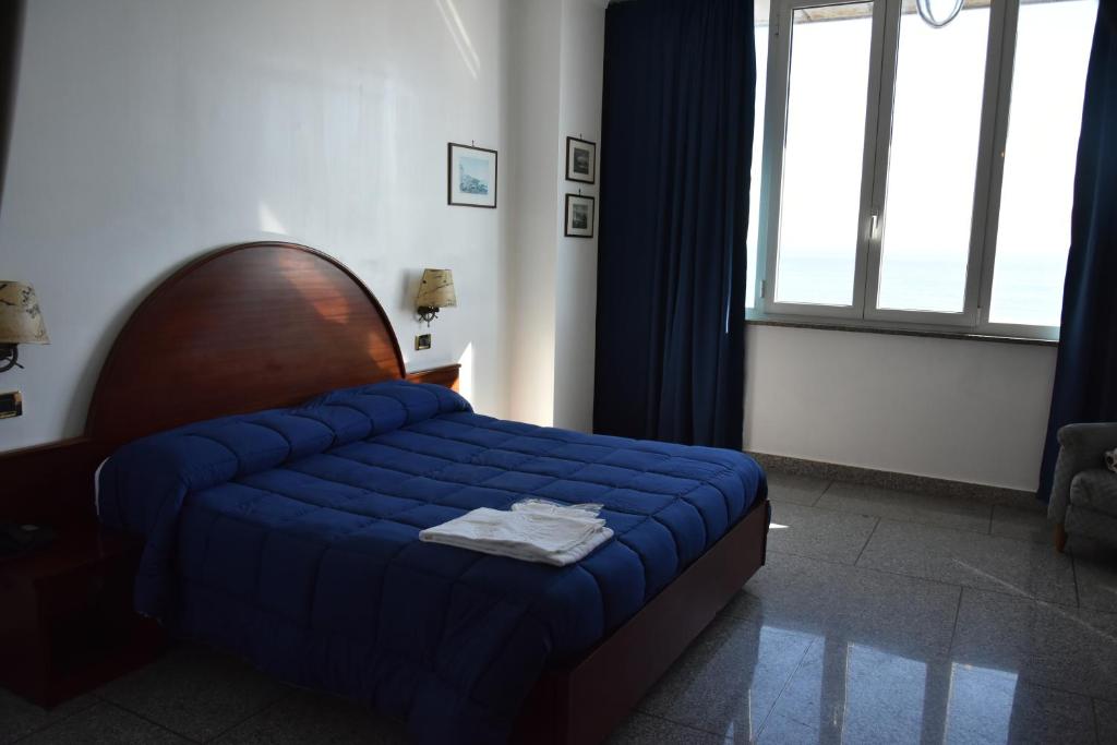 Postel nebo postele na pokoji v ubytování Hotel La Tripergola