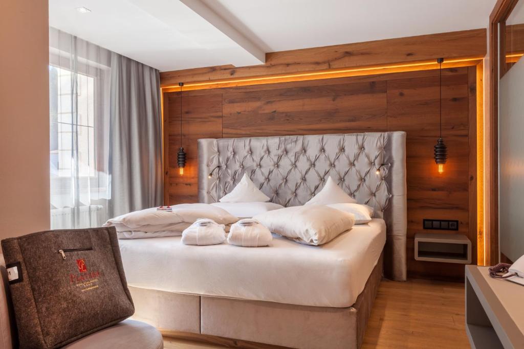 Postel nebo postele na pokoji v ubytování Hotel Platzer Superior