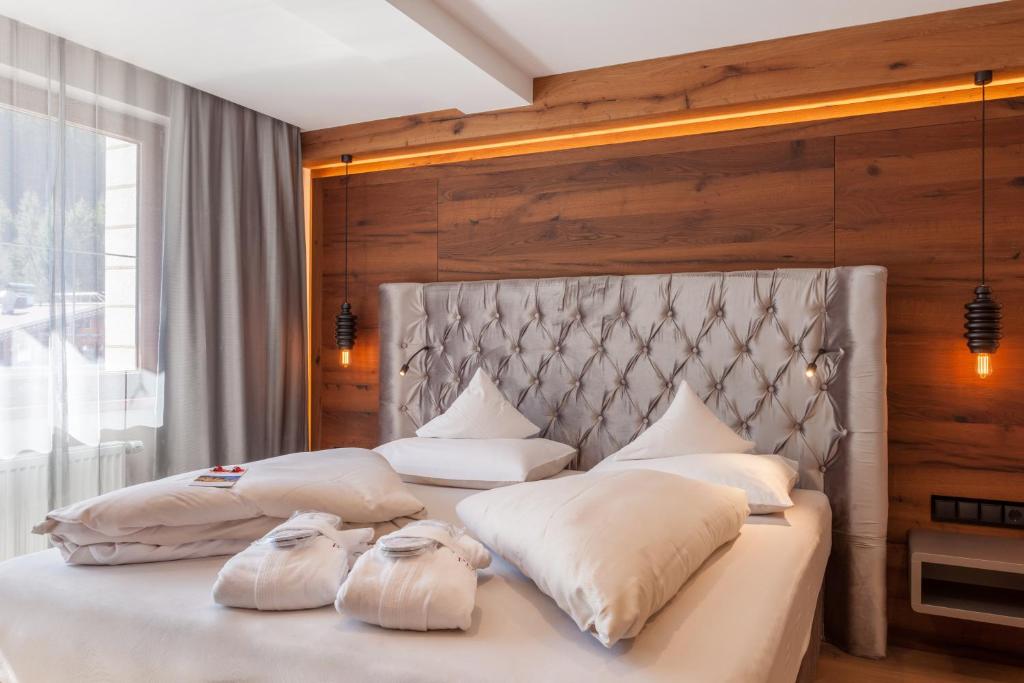 Postel nebo postele na pokoji v ubytování Hotel Platzer Superior