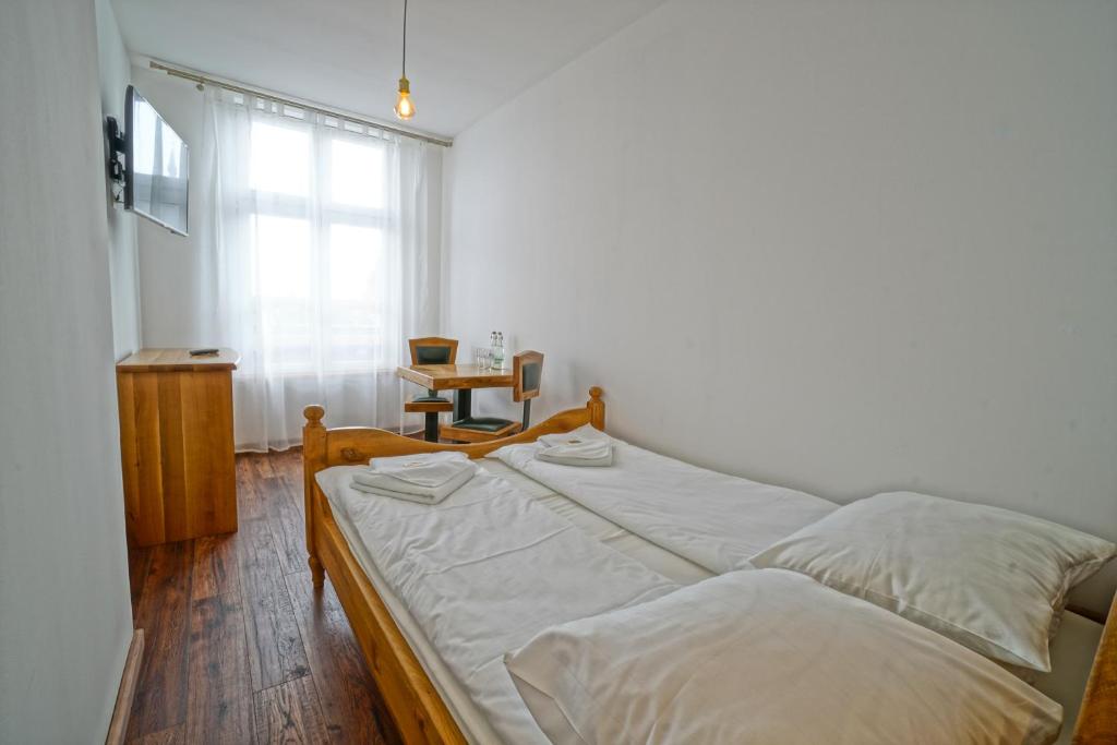 Posteľ alebo postele v izbe v ubytovaní Apartamenty Grodzka 8