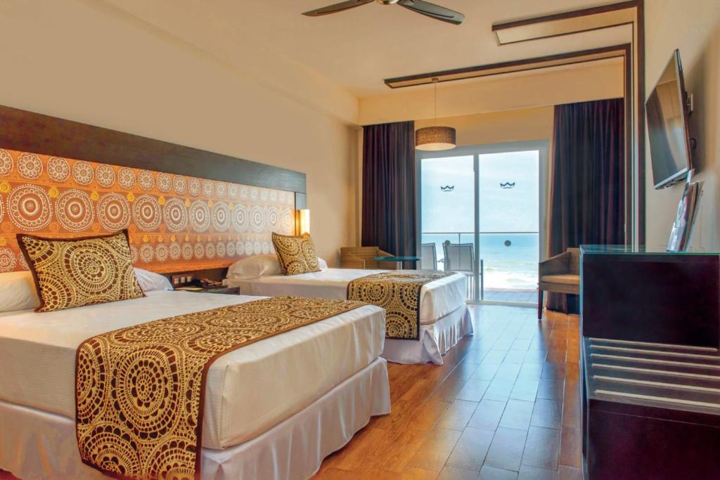 Postel nebo postele na pokoji v ubytování Riu Sri Lanka All Inclusive