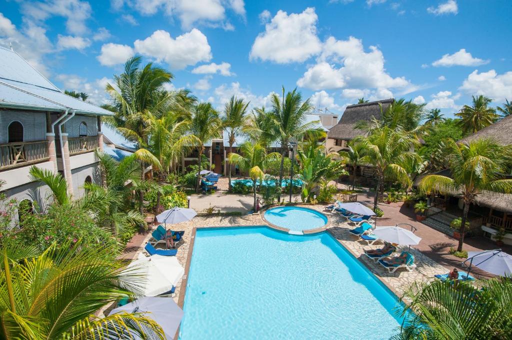 an aerial view of the pool at the resort at Le Palmiste Resort & Spa in Trou aux Biches