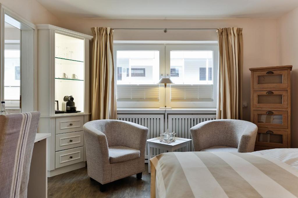 Postel nebo postele na pokoji v ubytování Hotel Uthland