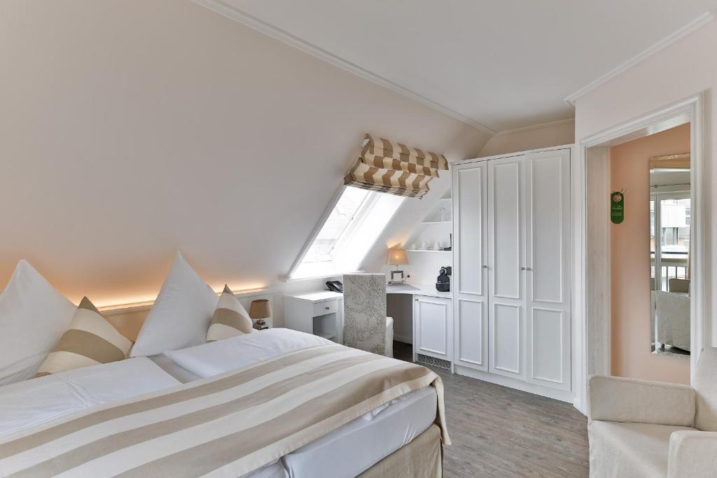 Postel nebo postele na pokoji v ubytování Hotel Uthland