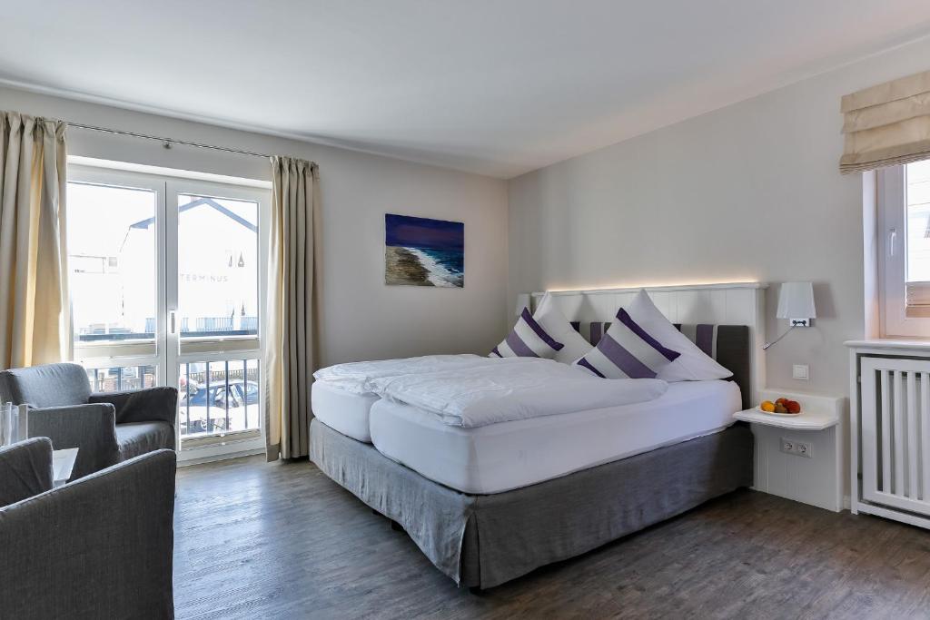 Postel nebo postele na pokoji v ubytování Hotel Uthland