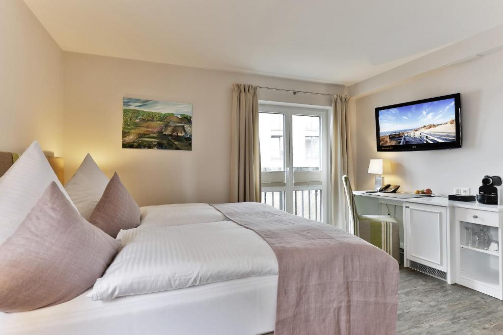 Postel nebo postele na pokoji v ubytování Hotel Uthland