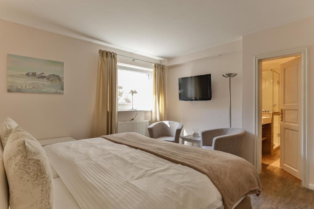 TV a/nebo společenská místnost v ubytování Hotel Uthland