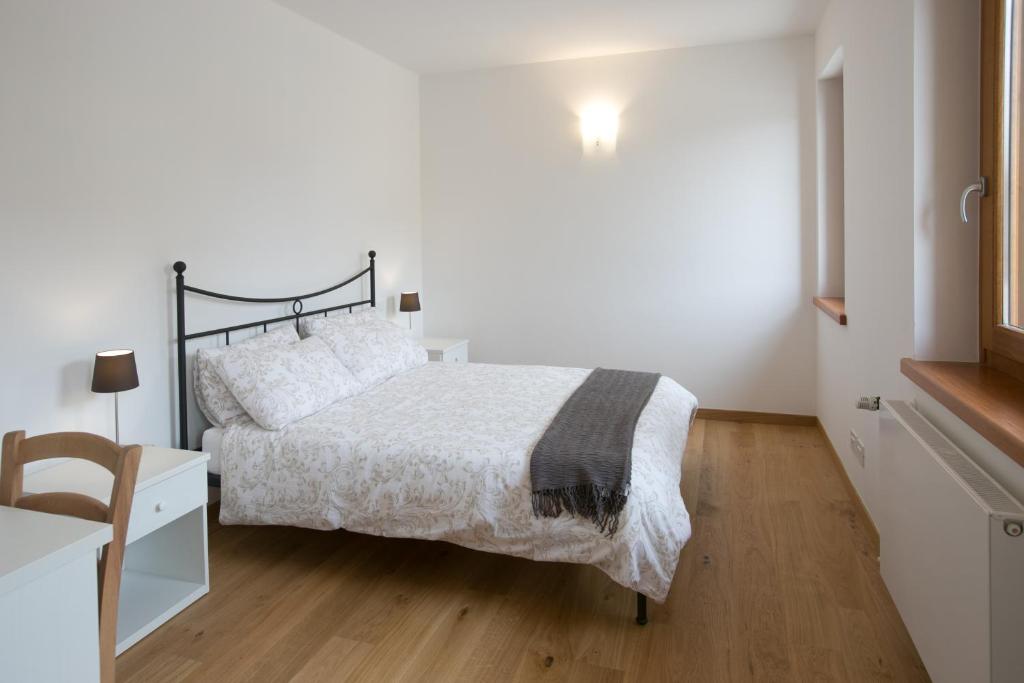 Postel nebo postele na pokoji v ubytování Agriturismo Mestroni