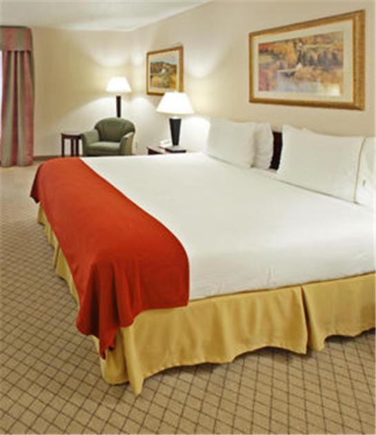 a large white bed in a hotel room at Holiday Inn Express - Hope by IHG in Hope