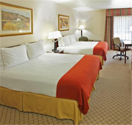 a hotel room with two beds and a desk at Holiday Inn Express - Hope by IHG in Hope