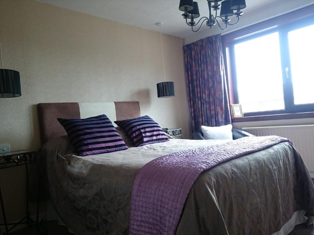 Postel nebo postele na pokoji v ubytování Albert Hotel