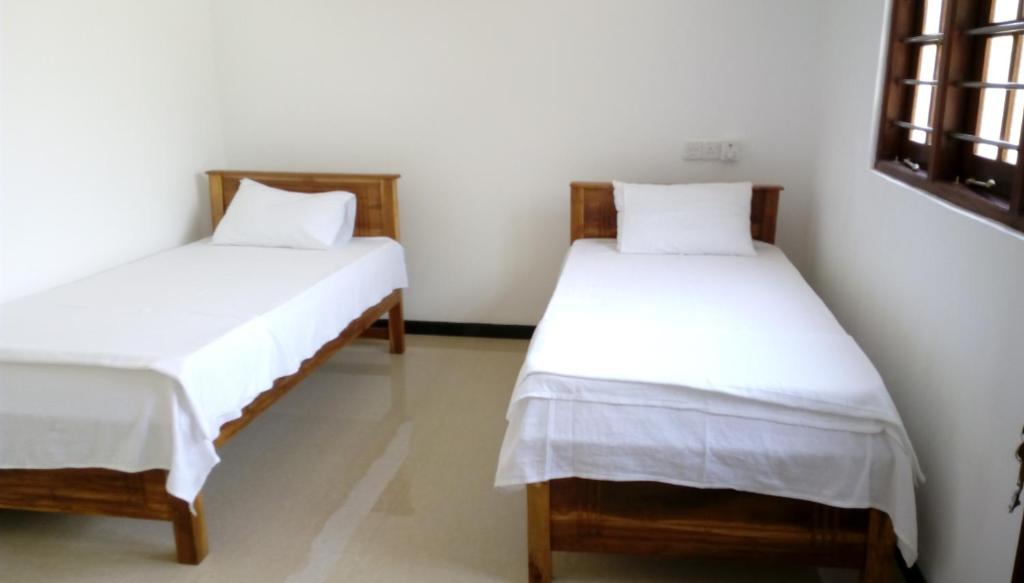 Postel nebo postele na pokoji v ubytování Dreams Villa