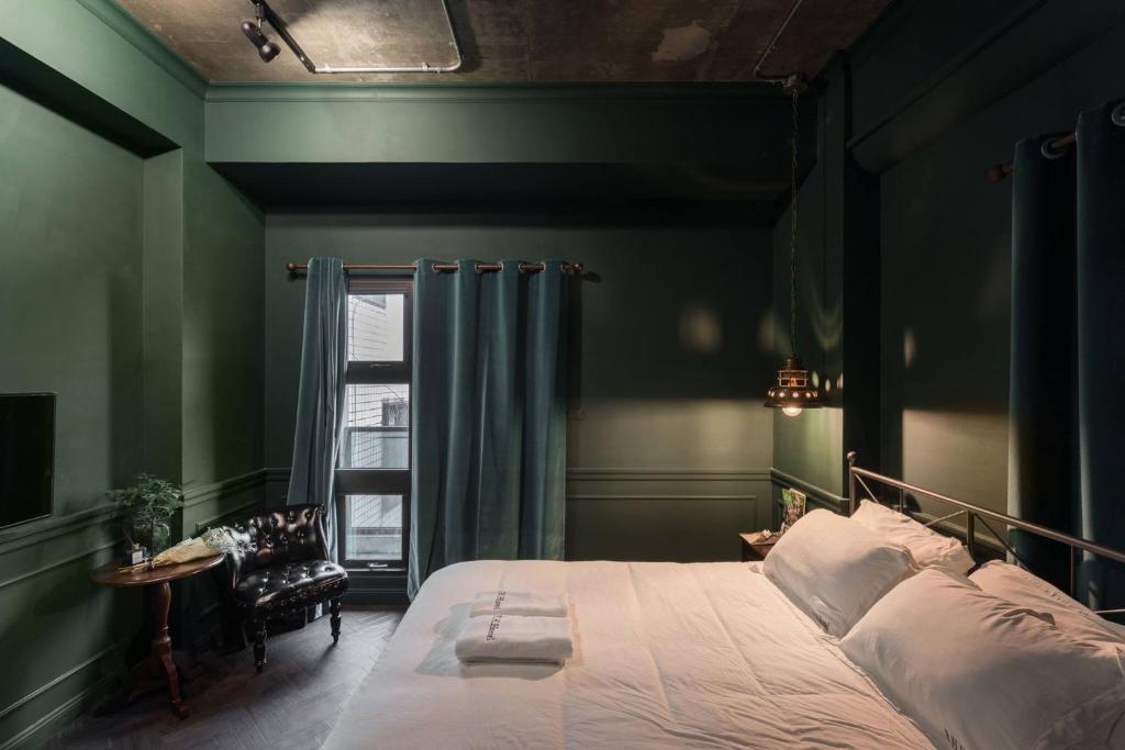 Ένα ή περισσότερα κρεβάτια σε δωμάτιο στο Railway Hualien Hostel