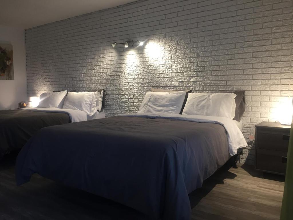 Postel nebo postele na pokoji v ubytování Complexe Dix80