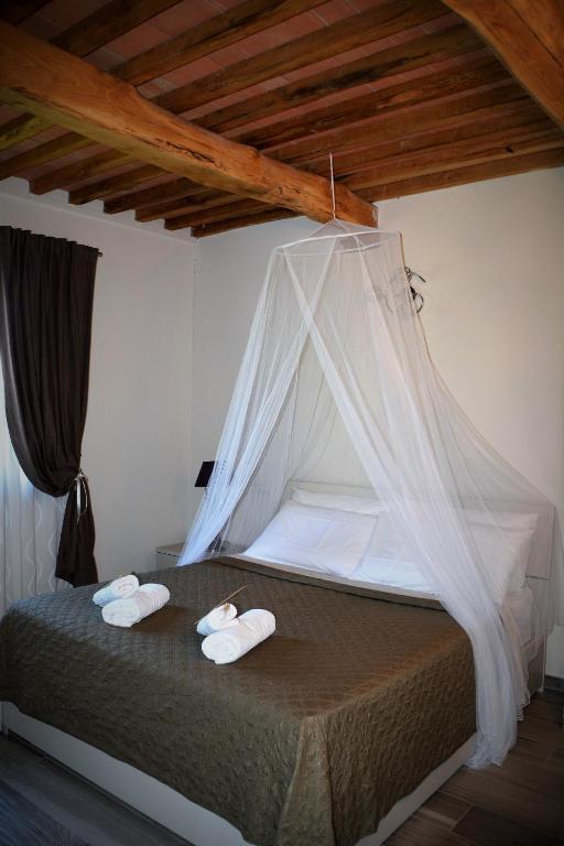 Postel nebo postele na pokoji v ubytování Agriturismo L'Aquilone