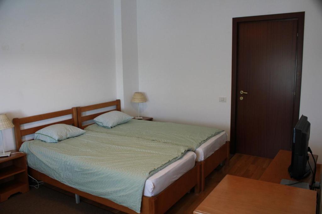 Postel nebo postele na pokoji v ubytování Casa Pescarilor