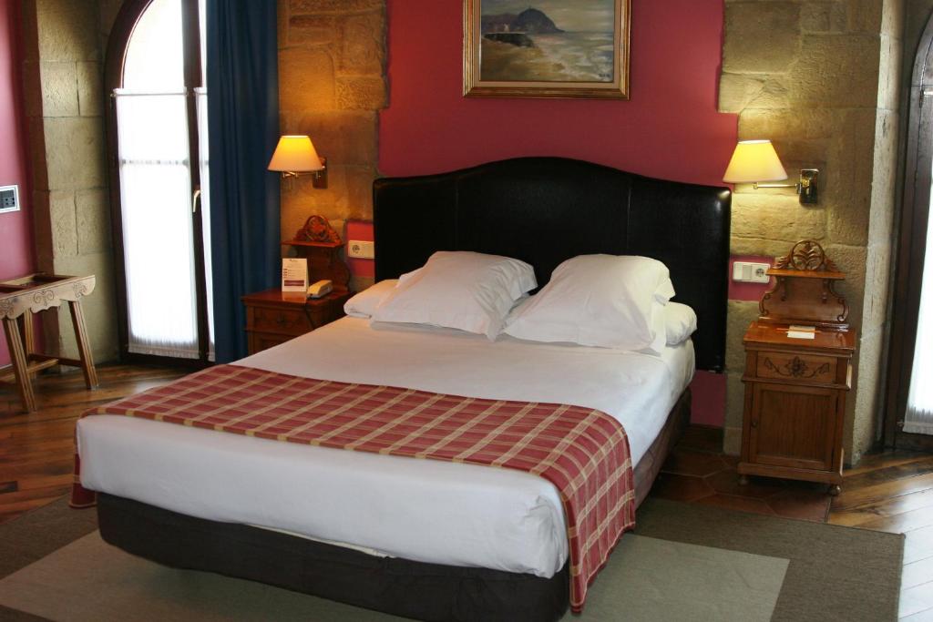 Postel nebo postele na pokoji v ubytování Hotel Palacio Obispo