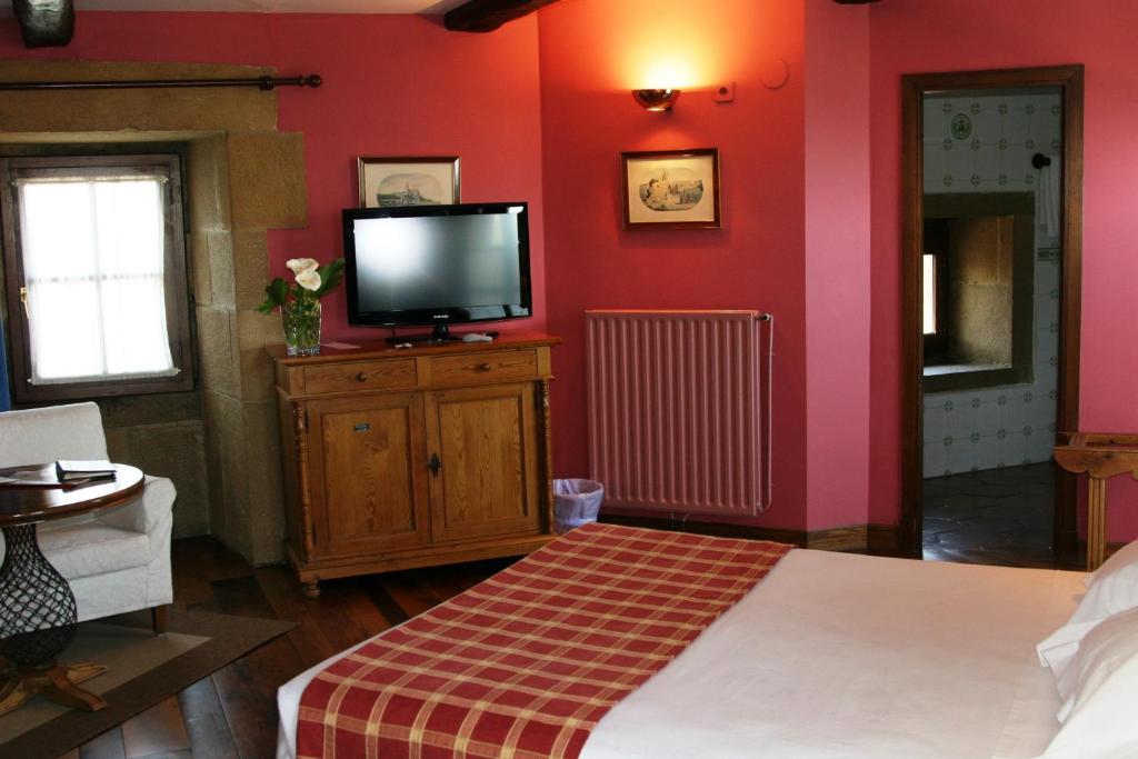 Postel nebo postele na pokoji v ubytování Hotel Palacio Obispo
