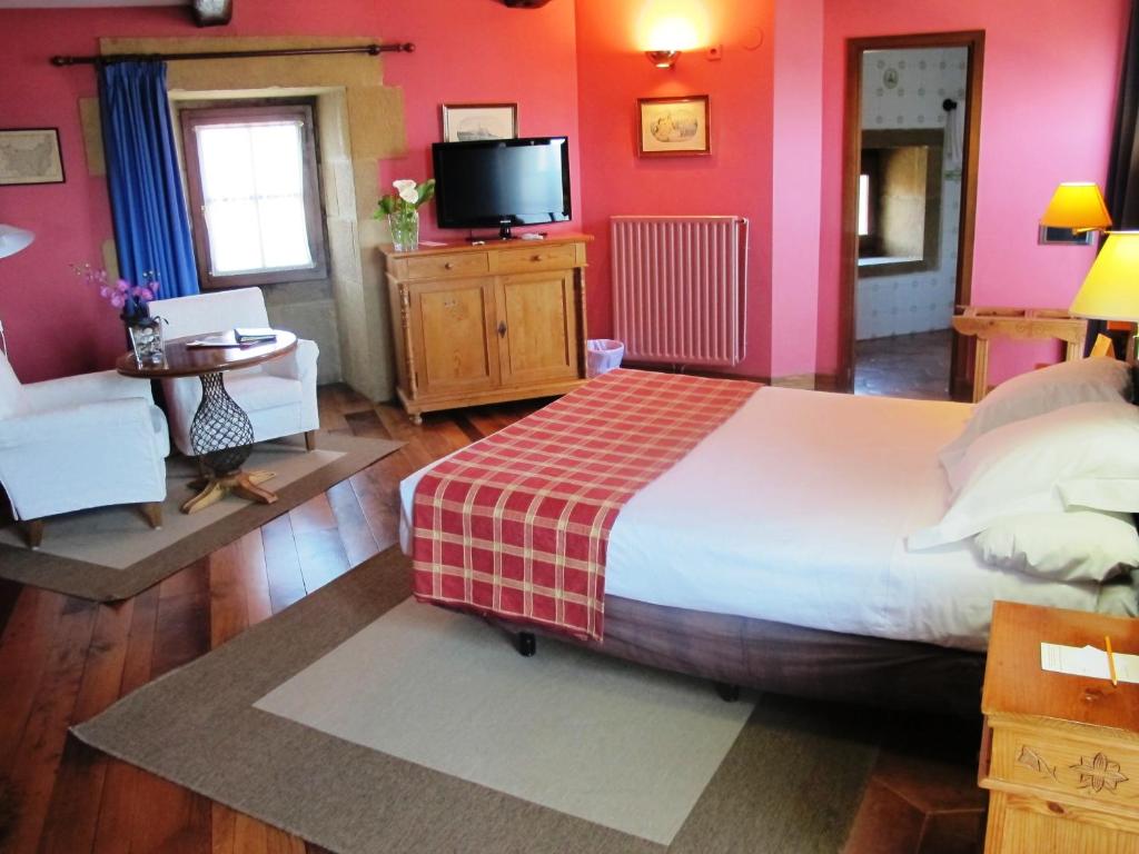 Postel nebo postele na pokoji v ubytování Hotel Palacio Obispo