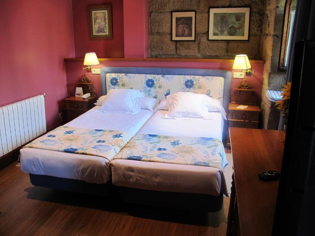 Postel nebo postele na pokoji v ubytování Hotel Palacio Obispo