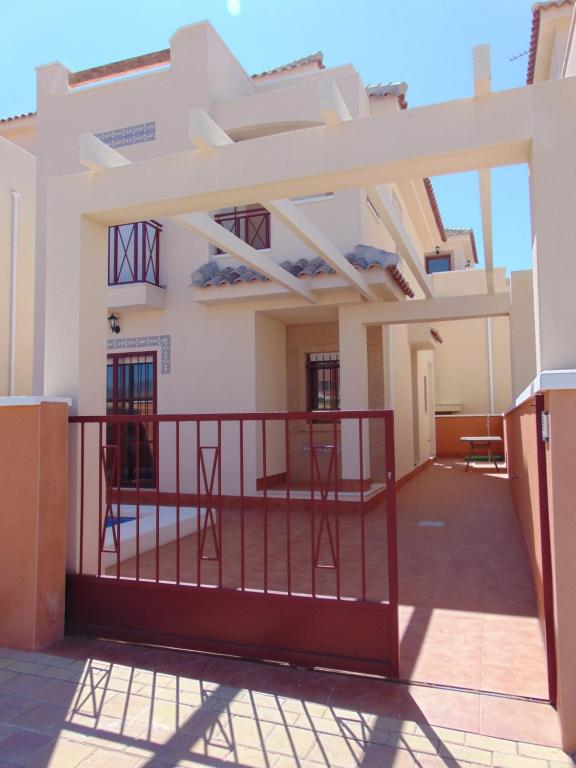 a view of the outside of a house with a balcony at Duplex 8 in Puerto de Mazarrón