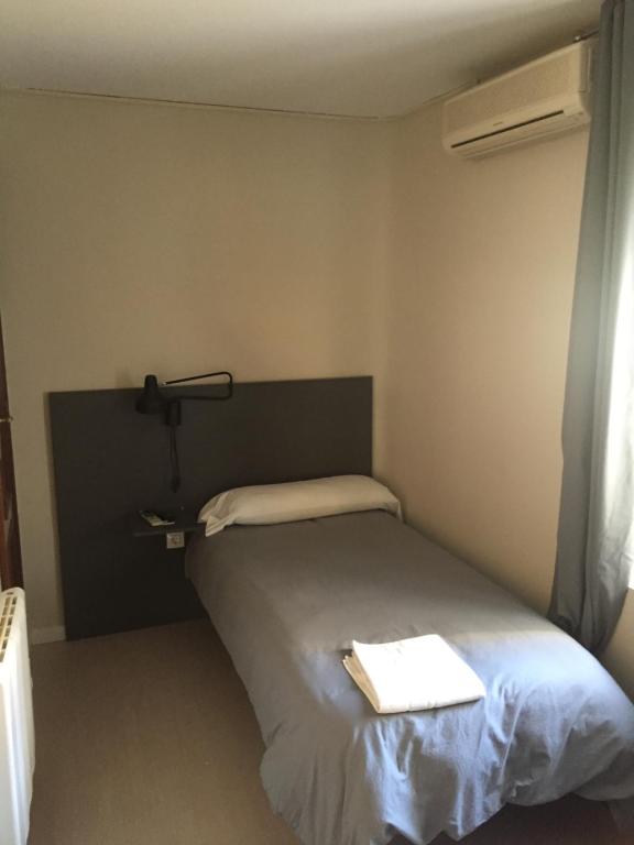 Posteľ alebo postele v izbe v ubytovaní Hostal La Estación