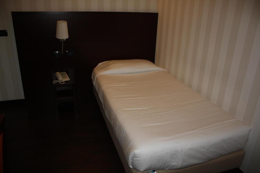 Postel nebo postele na pokoji v ubytování Hotel 2C