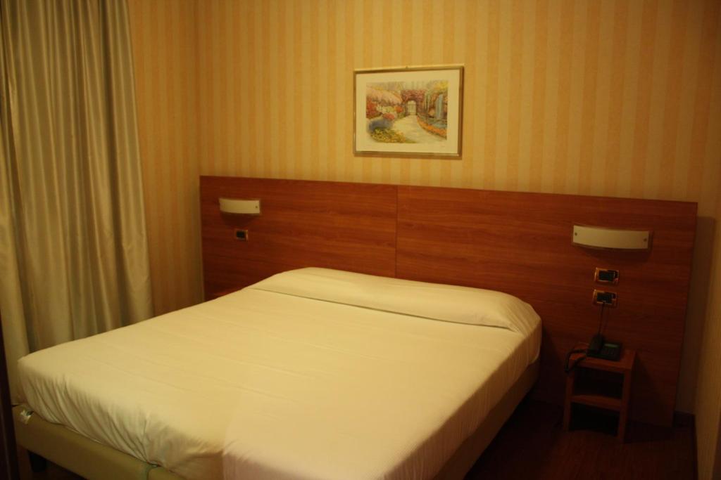 Postel nebo postele na pokoji v ubytování Hotel 2C