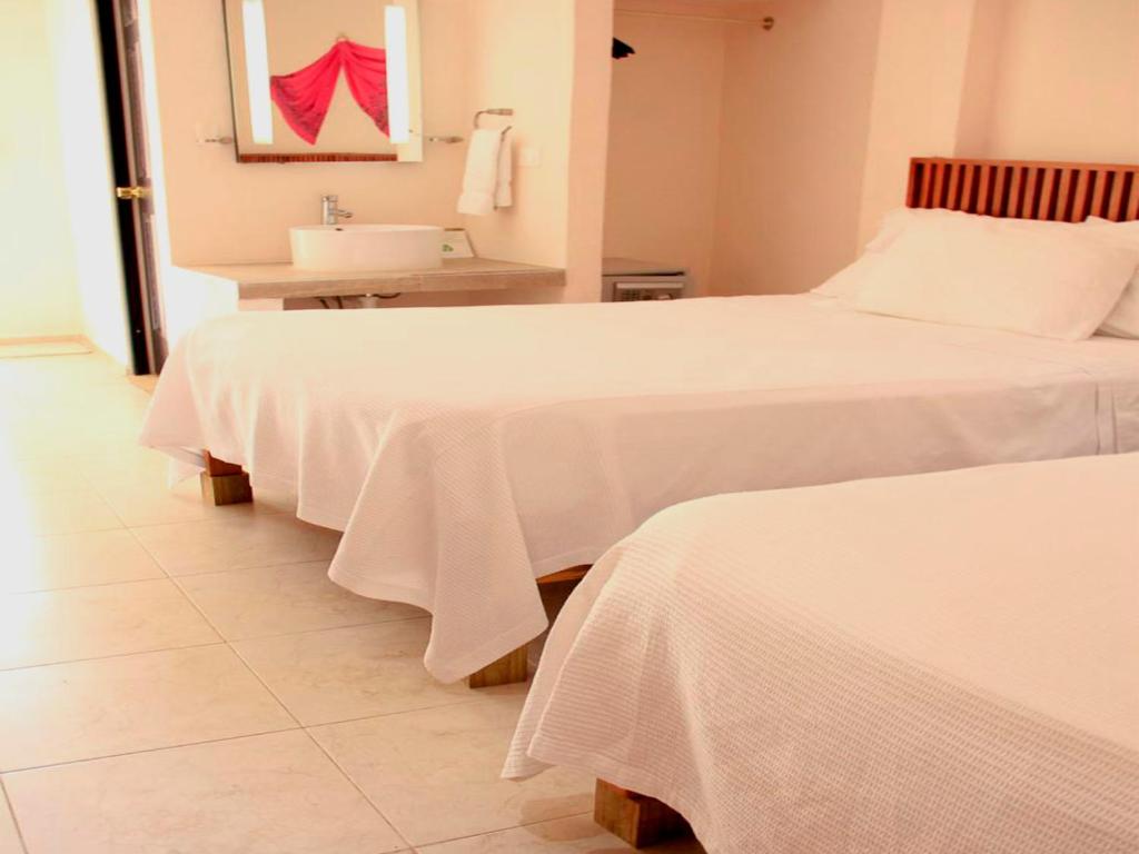 Postel nebo postele na pokoji v ubytování Hotel Zamna Boutique