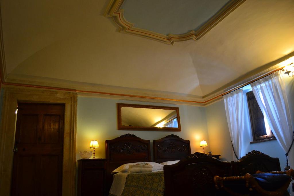 Postel nebo postele na pokoji v ubytování B&B Palazzo La Loggia