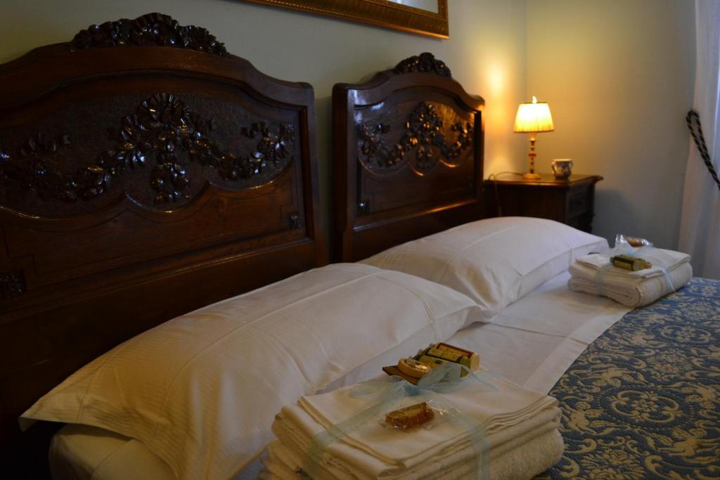 Postel nebo postele na pokoji v ubytování B&B Palazzo La Loggia