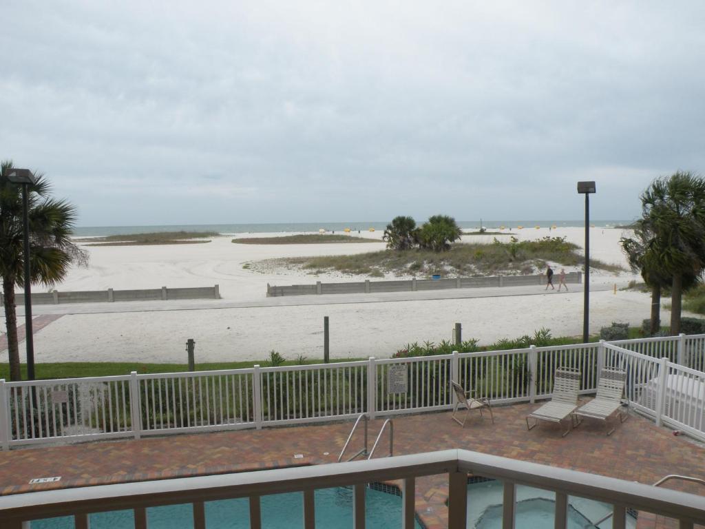 a view of the beach from the balcony of a condo at Surf Beach Resort by Sunsational Beach Rentals in St. Pete Beach