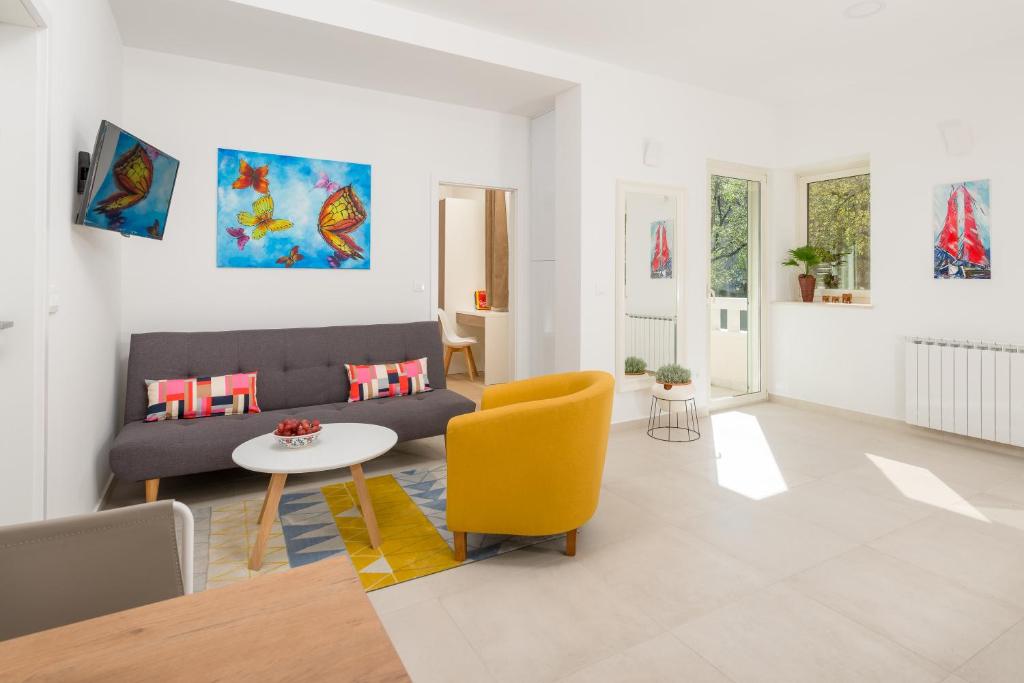 a living room with a couch and a table at Urban Chic LUXE apartments near Beach Bačvice & CENTRE in Split