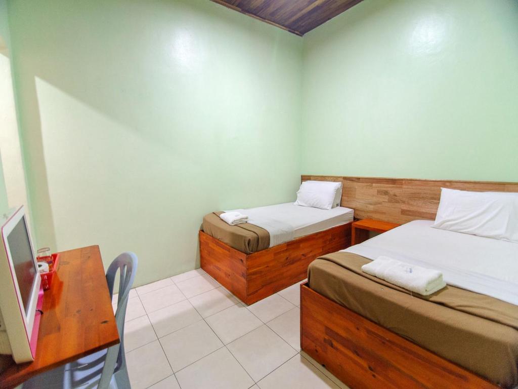 Postel nebo postele na pokoji v ubytování Y&Z Hotel