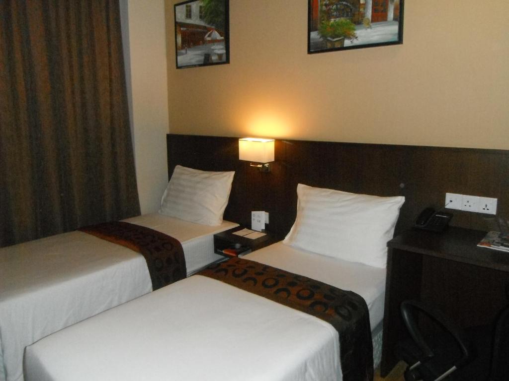 Postel nebo postele na pokoji v ubytování Keoja Hotel