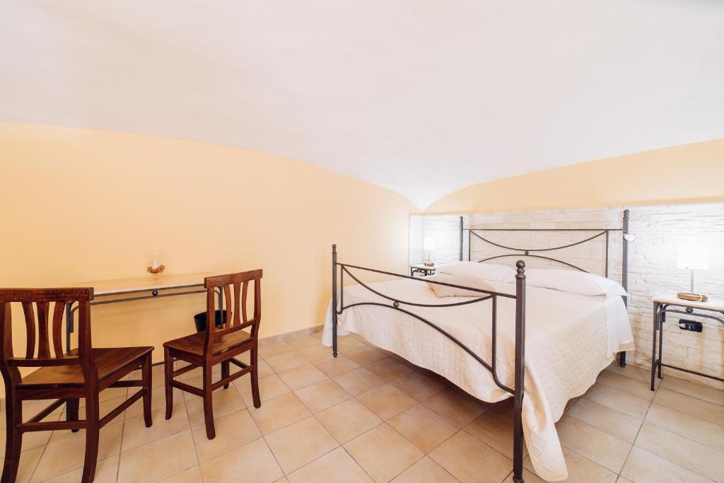 Łóżko lub łóżka w pokoju w obiekcie B&B La Casa Di Plinio