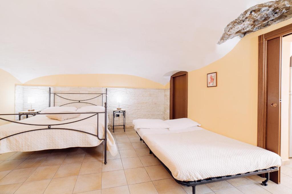 Łóżko lub łóżka w pokoju w obiekcie B&B La Casa Di Plinio