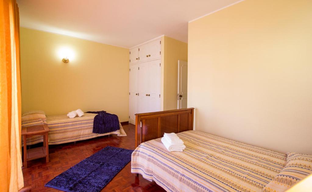 Postel nebo postele na pokoji v ubytování CASA BELAVISTA - BAÍA