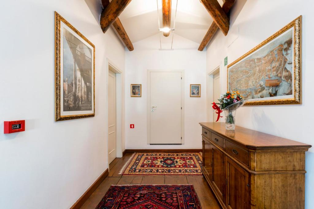 a hallway with a large painting on the wall at Villa Casanova in Venice-Lido