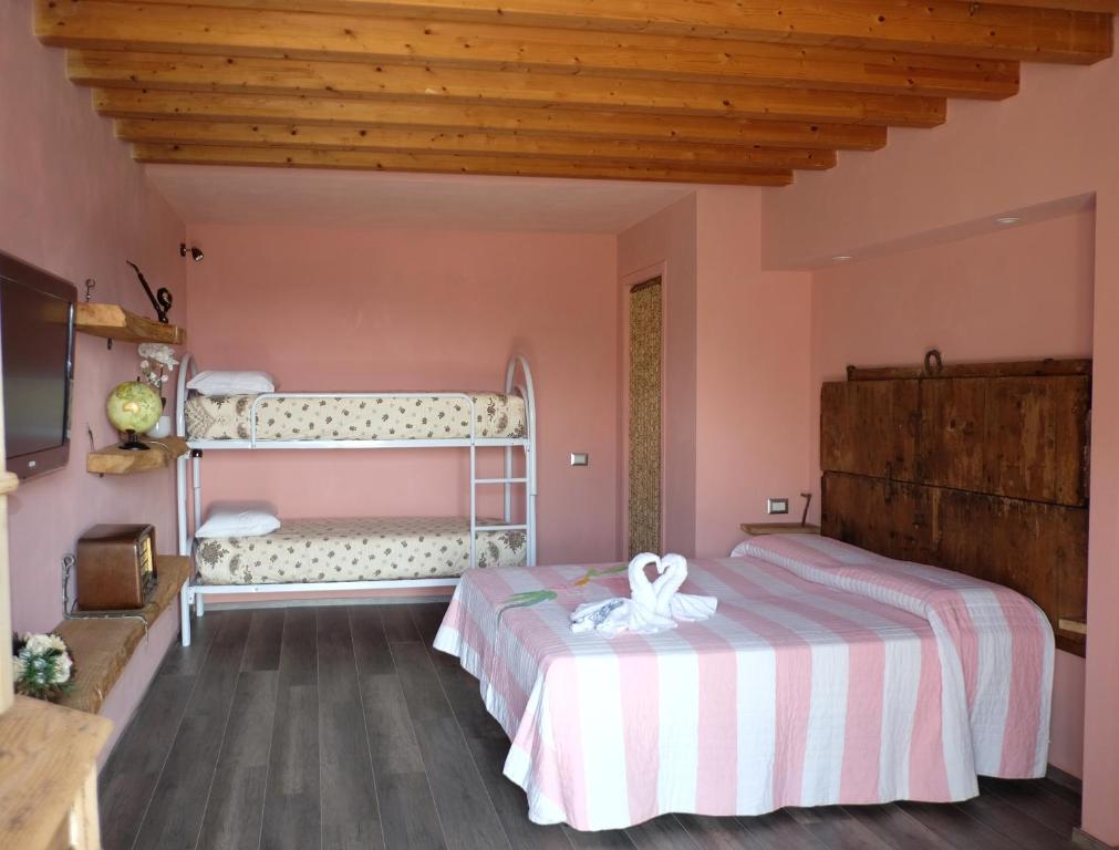 Postel nebo postele na pokoji v ubytování La Bosca agriturismo