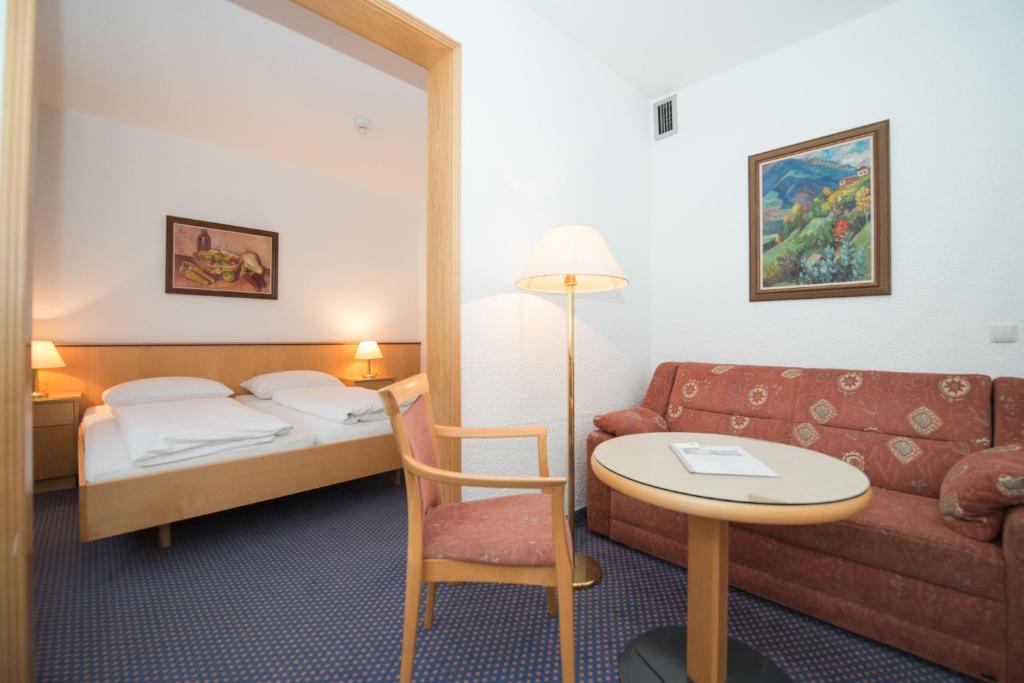 Postel nebo postele na pokoji v ubytování Parkhotel Styria
