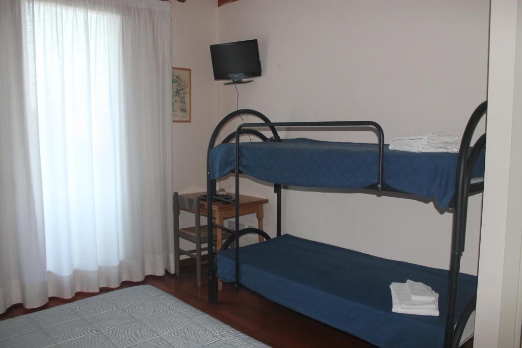 Postel nebo postele na pokoji v ubytování B&B Armonia
