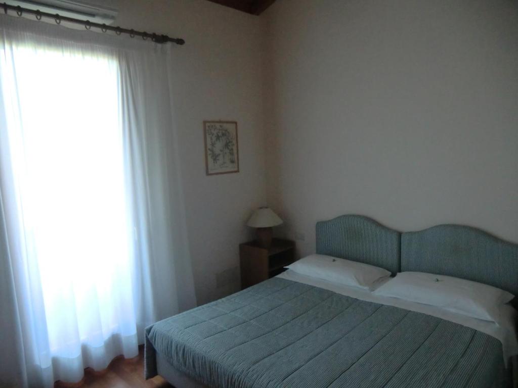 Postel nebo postele na pokoji v ubytování B&B Armonia