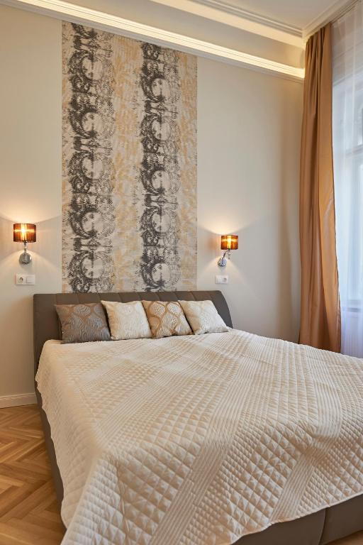Posteľ alebo postele v izbe v ubytovaní Falk Miksa Apartment