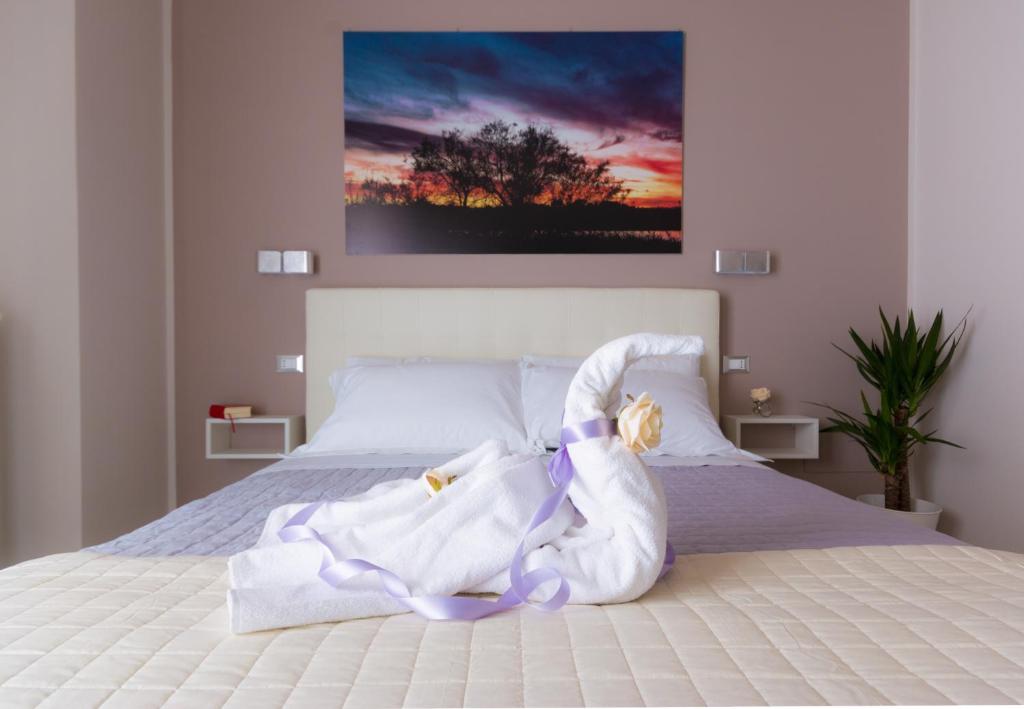 Postel nebo postele na pokoji v ubytování PhotoGuest B&B