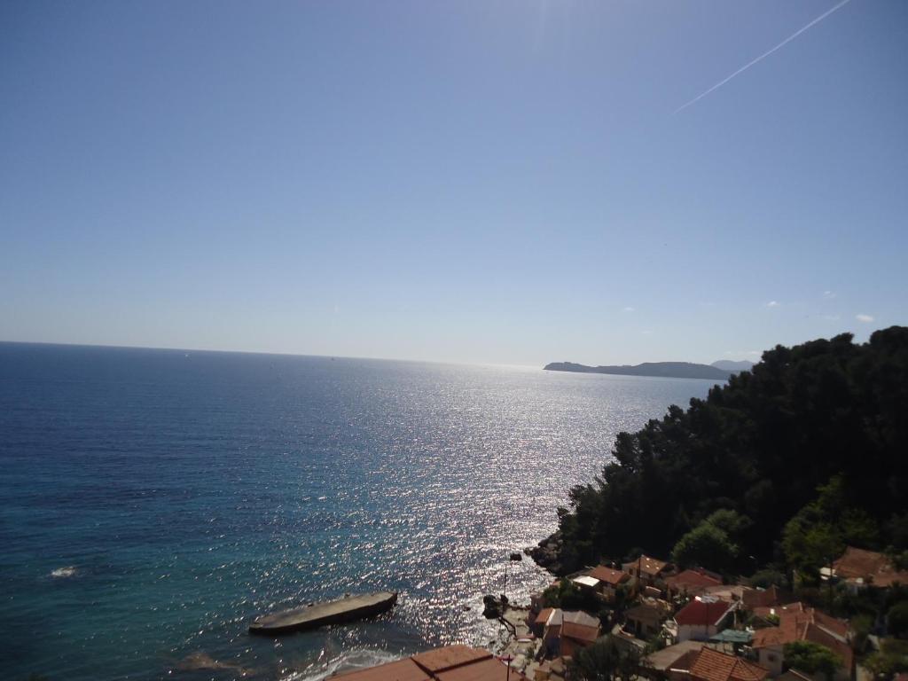 a large body of water with two boats in it at Studio du Pouverel in La Garde