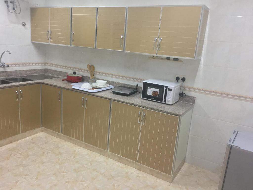 Kuchyň nebo kuchyňský kout v ubytování Zaki Hotel Apartment