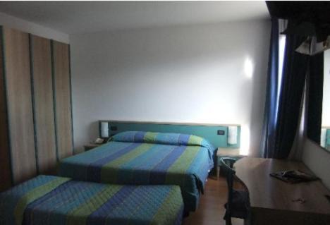 Postel nebo postele na pokoji v ubytování Hotel Vela