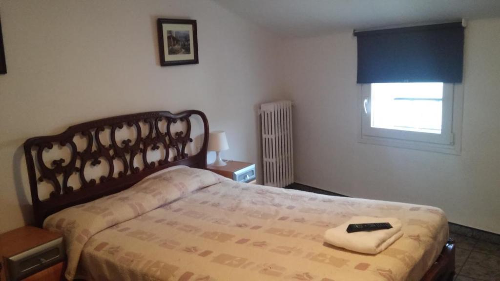 Postel nebo postele na pokoji v ubytování Hostal Porta De Núria