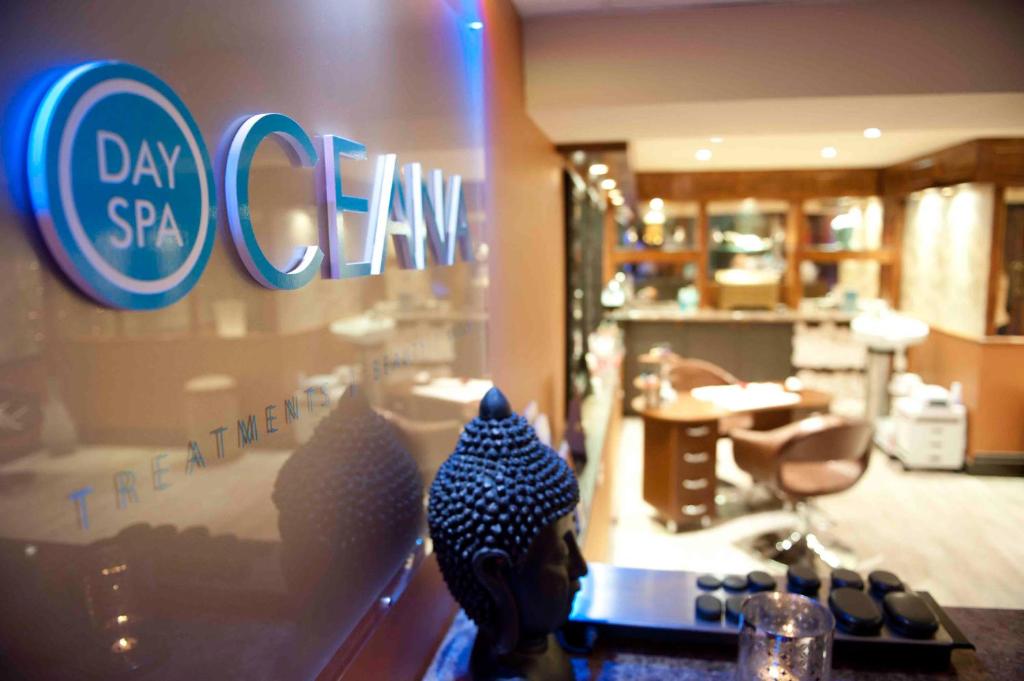 a store window with a sign for day spa claw at Cumberland Hotel - OCEANA COLLECTION in Bournemouth